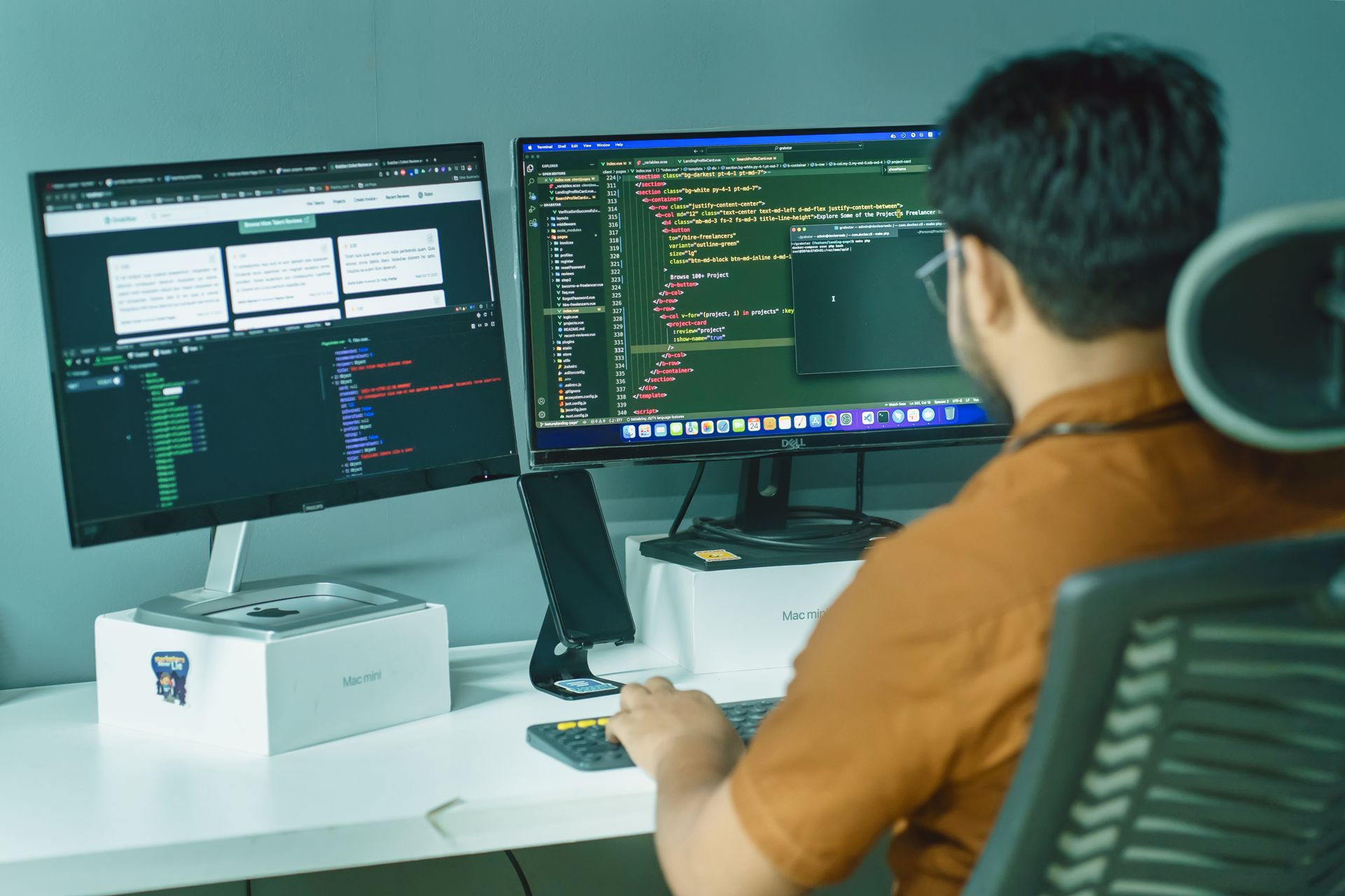 Professional working at a desk with two monitors