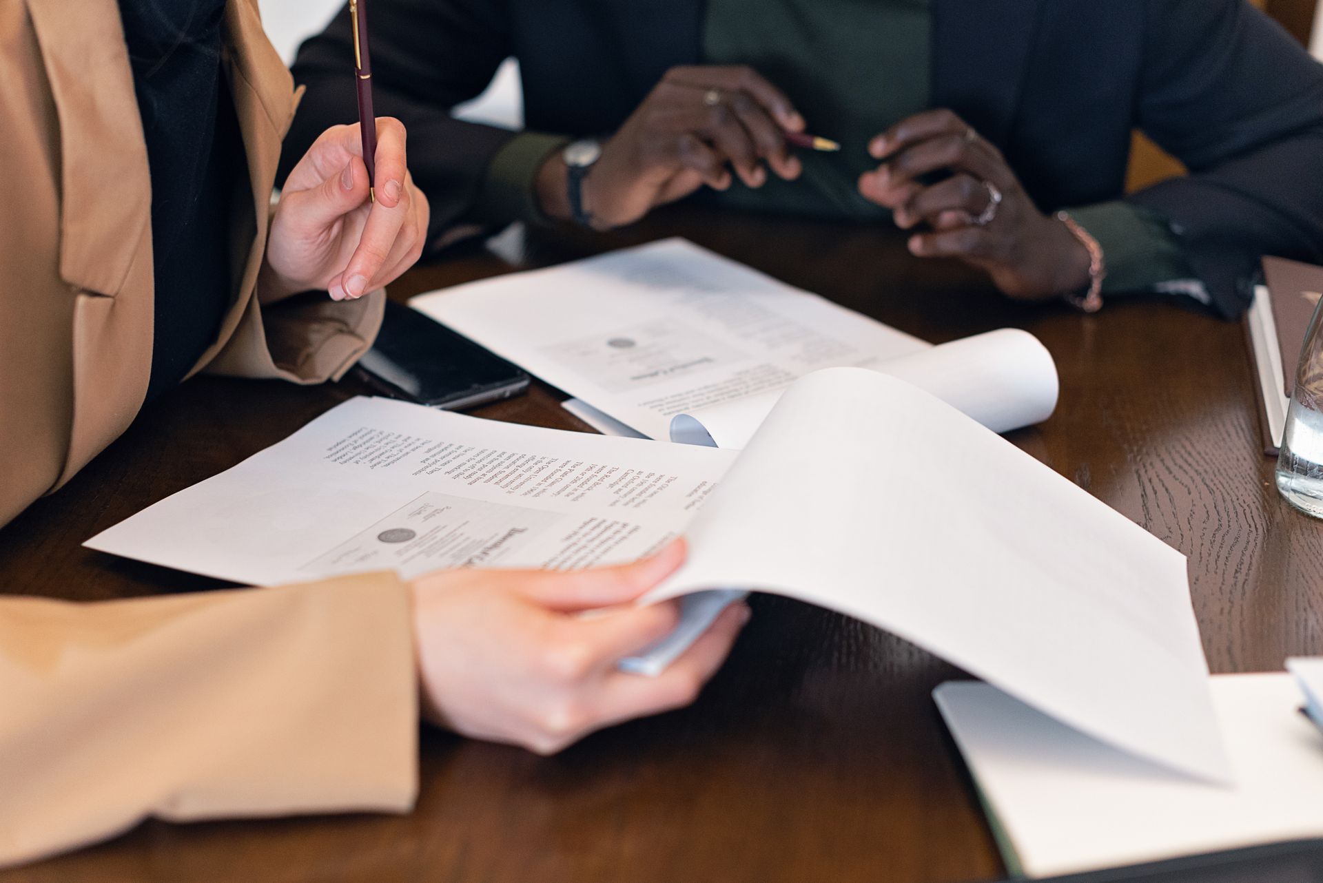 Two professionals reviewing documents together at a desk