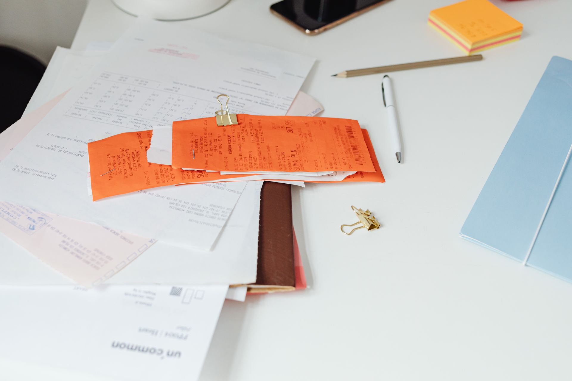 Organized desk with document folders and paperwork ready to go