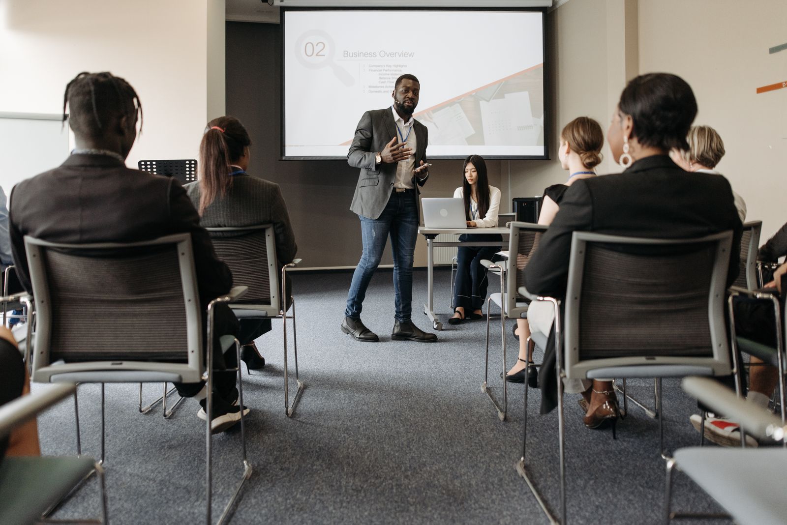 Business presentation to a meeting room audience