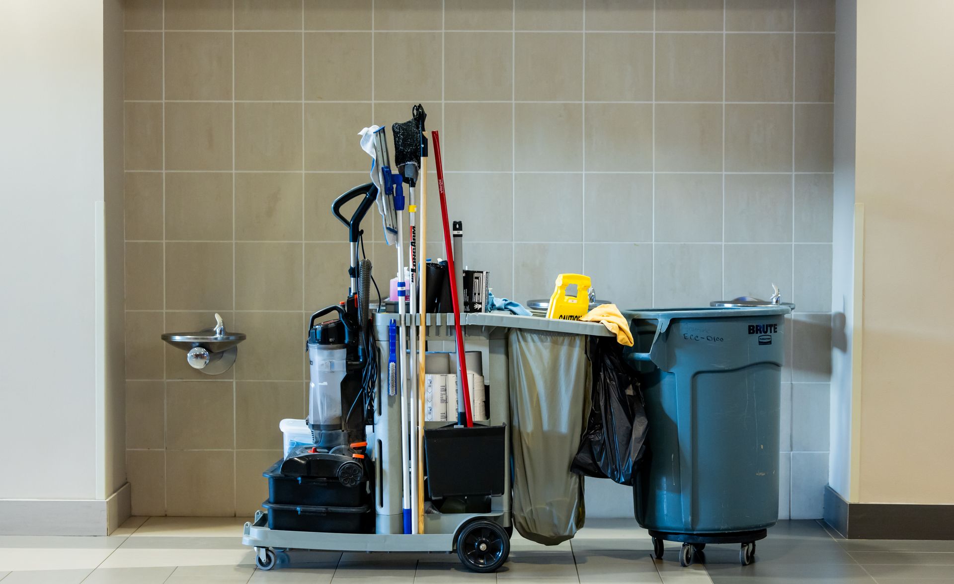 Professional cleaning equipment cart in a commercial facility