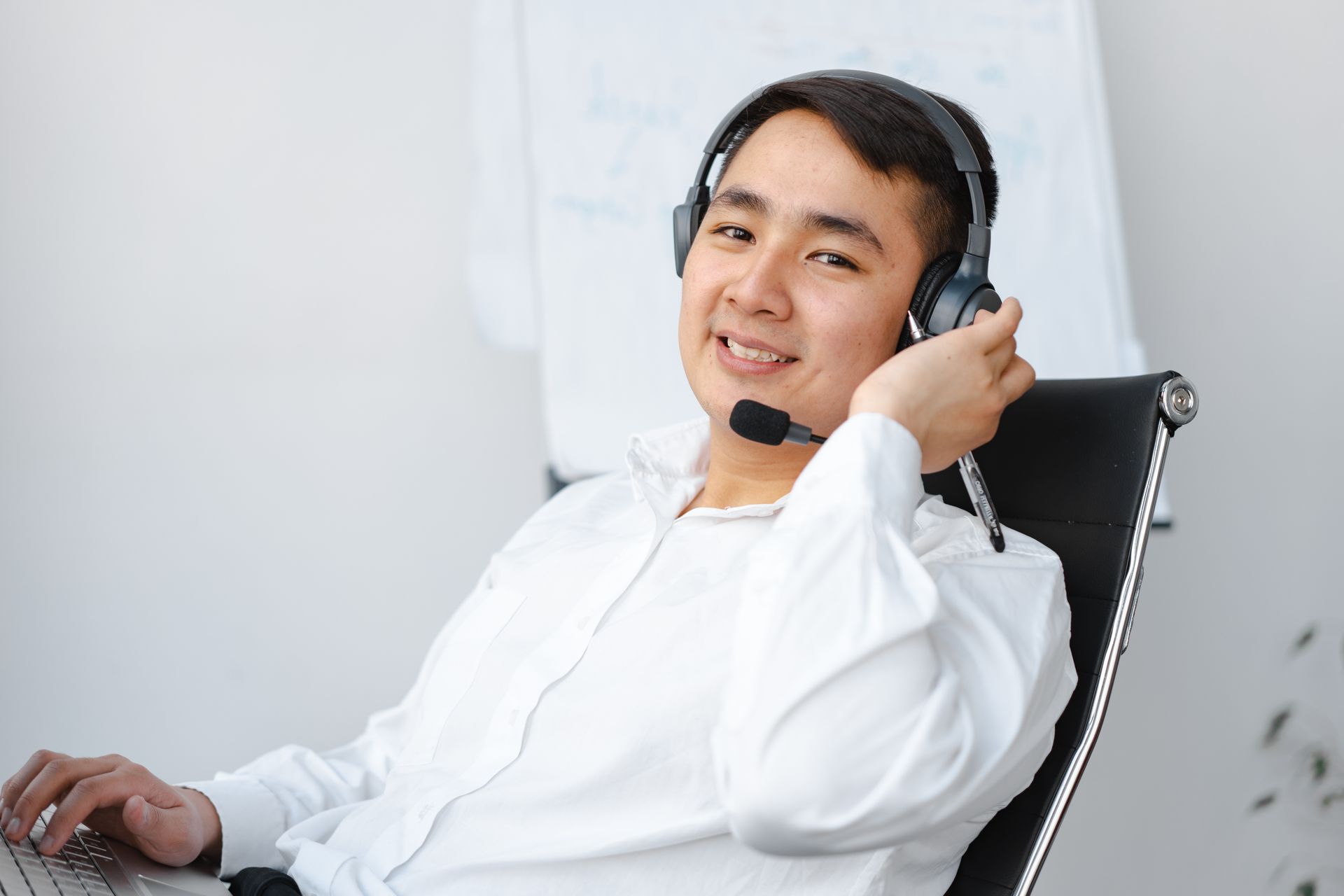 Support agent wearing a headset at a desk