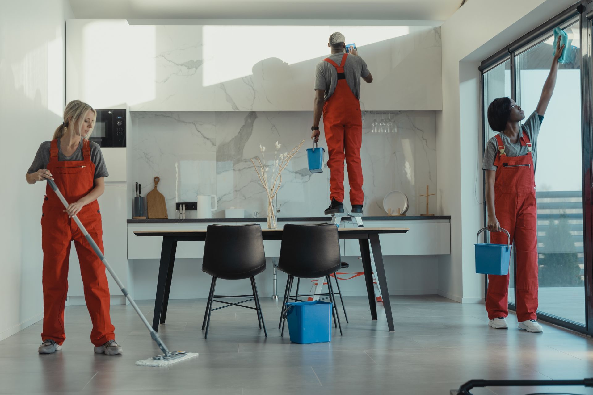 Uniformed cleaning crew at work in a commercial dining facility