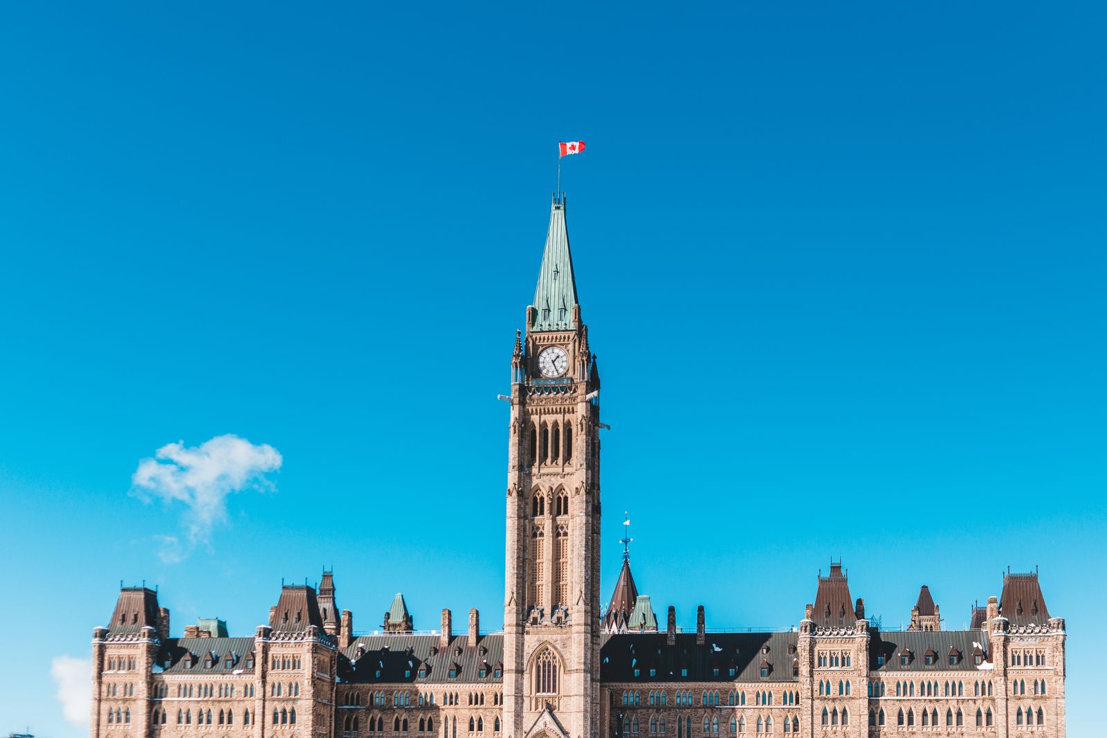 Parliament Hill in Ottawa with the Canadian flag flying