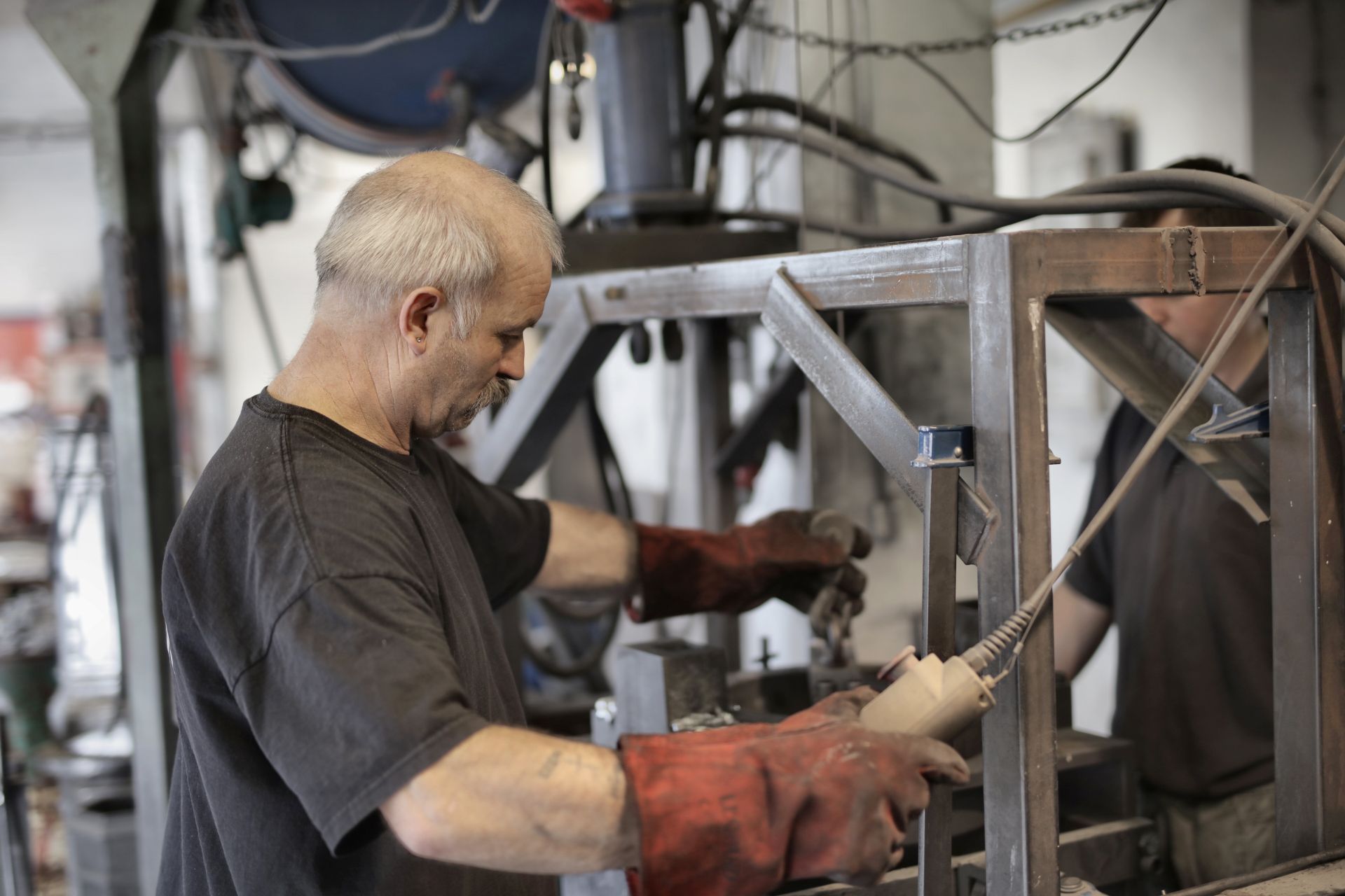 Skilled worker operating industrial machinery in a factory