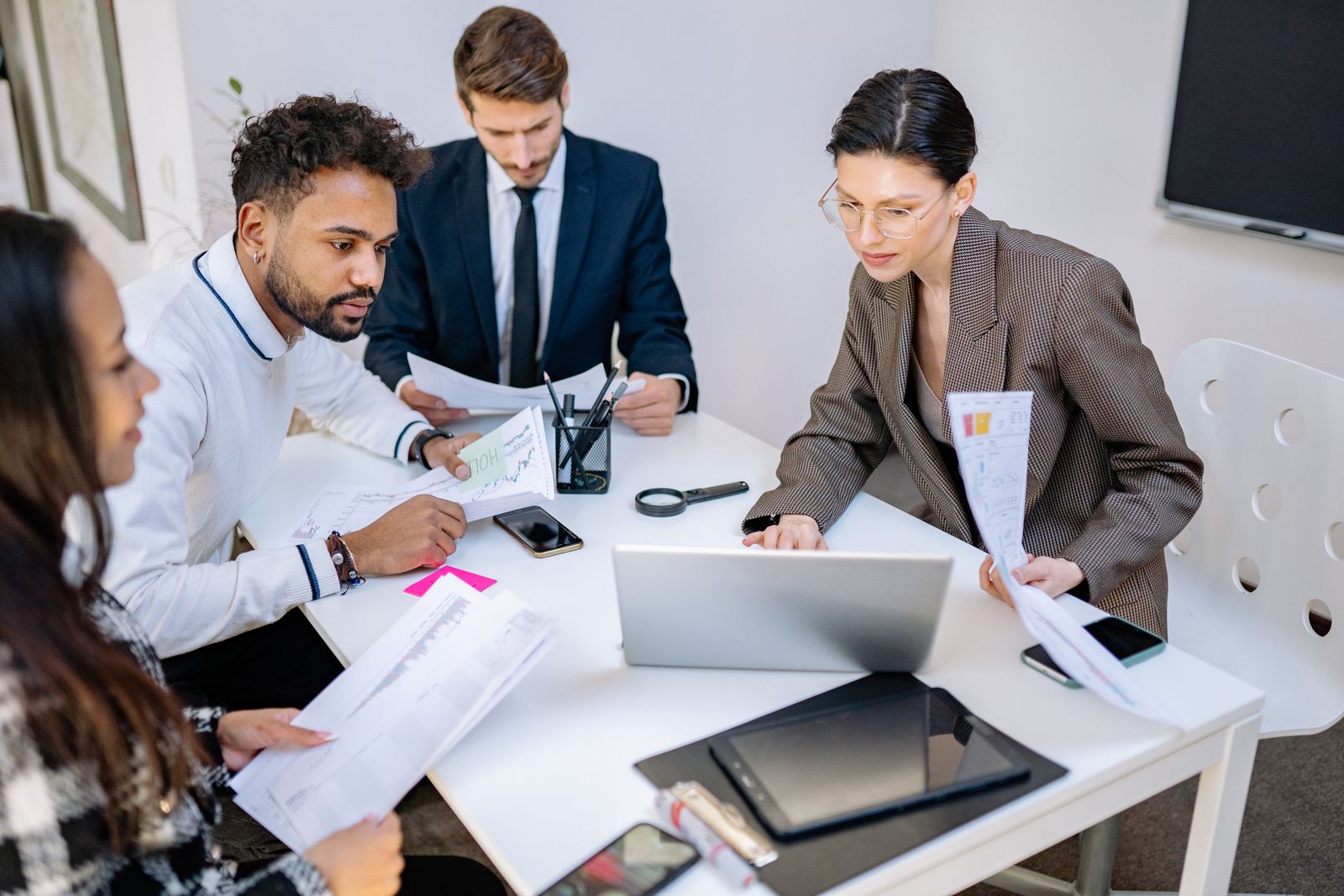 Team reviewing documents together around a table