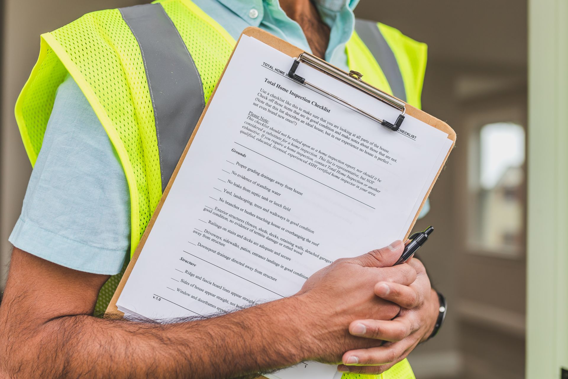 Evaluator marking a scoring checklist on a clipboard